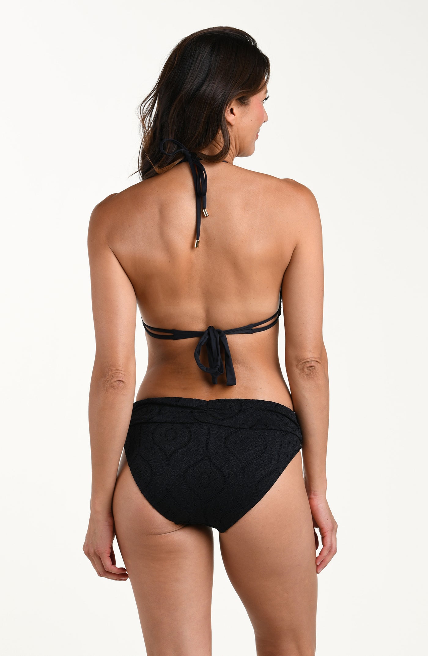 
                  
                    Back image of model wearing a black colored jacquard fabric halter triangle top featuring soft neck and back ties. This is paired with matching bikini bottoms. 
                  
                