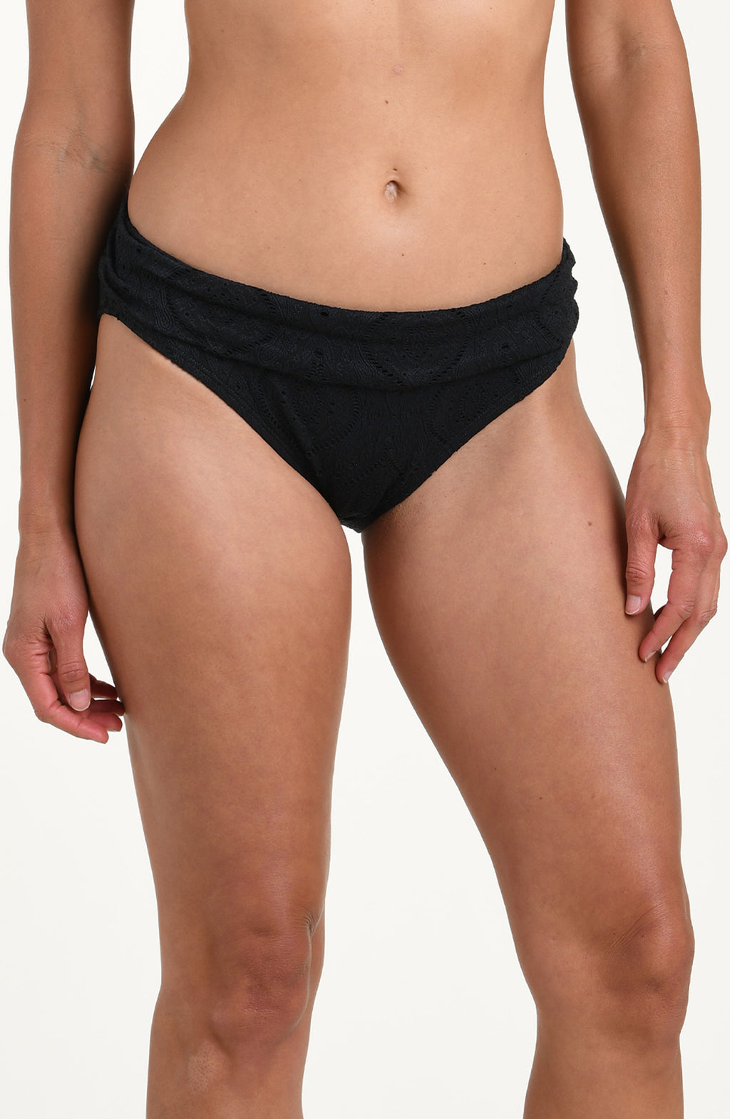 Front image of model wearing a black jacquard fabric hipster swimsuit bottom featuring a shirred front band. 
