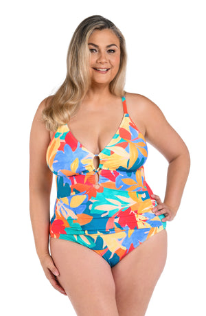 Model is wearing an orange, pink, blue, and aqua multicolored tropical patterned underwire lace front one piece swimsuit.