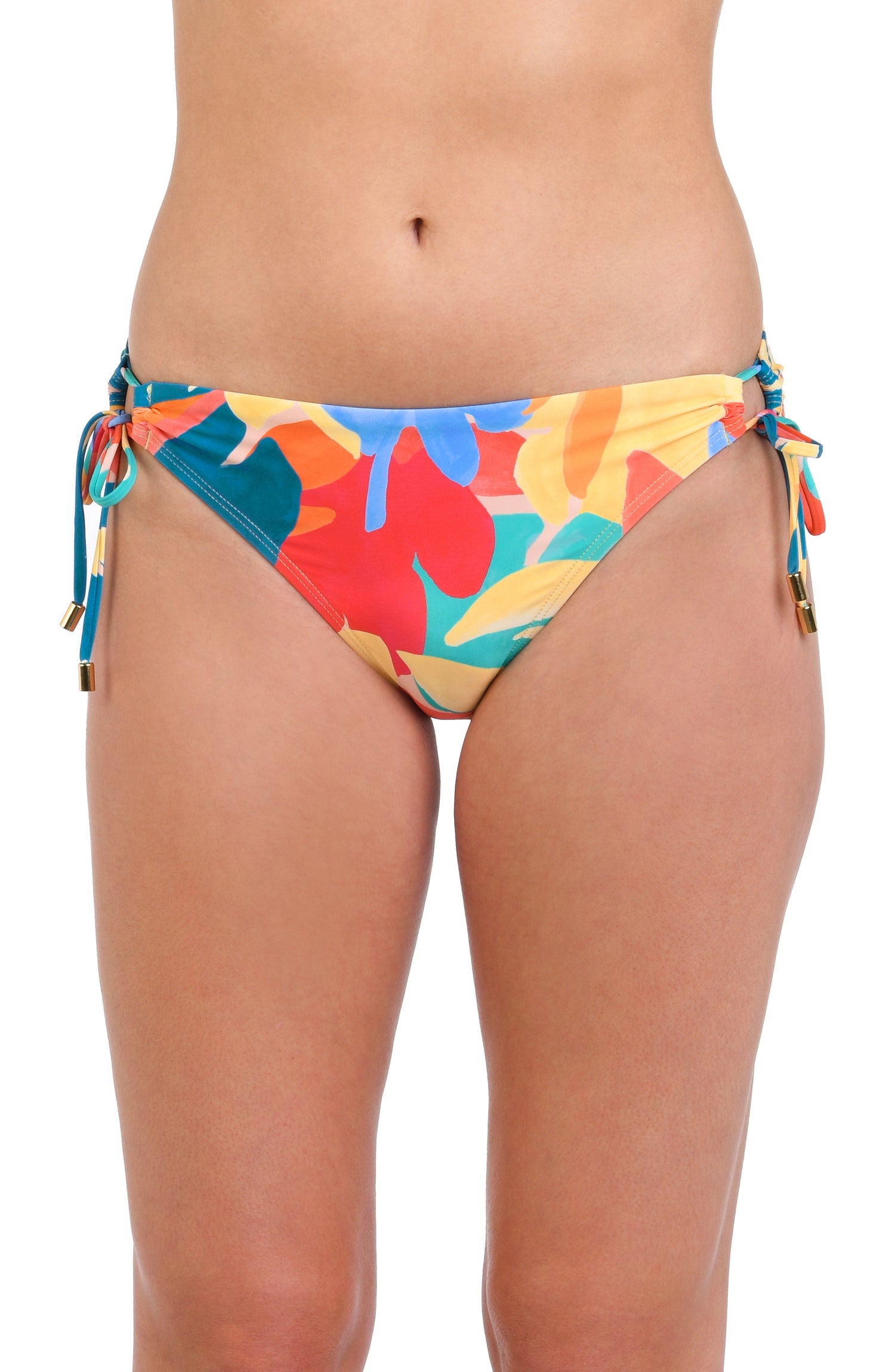 Model is wearing an orange, pink, blue, and aqua multicolored tropical patterned side tie hipster bikini bottom.