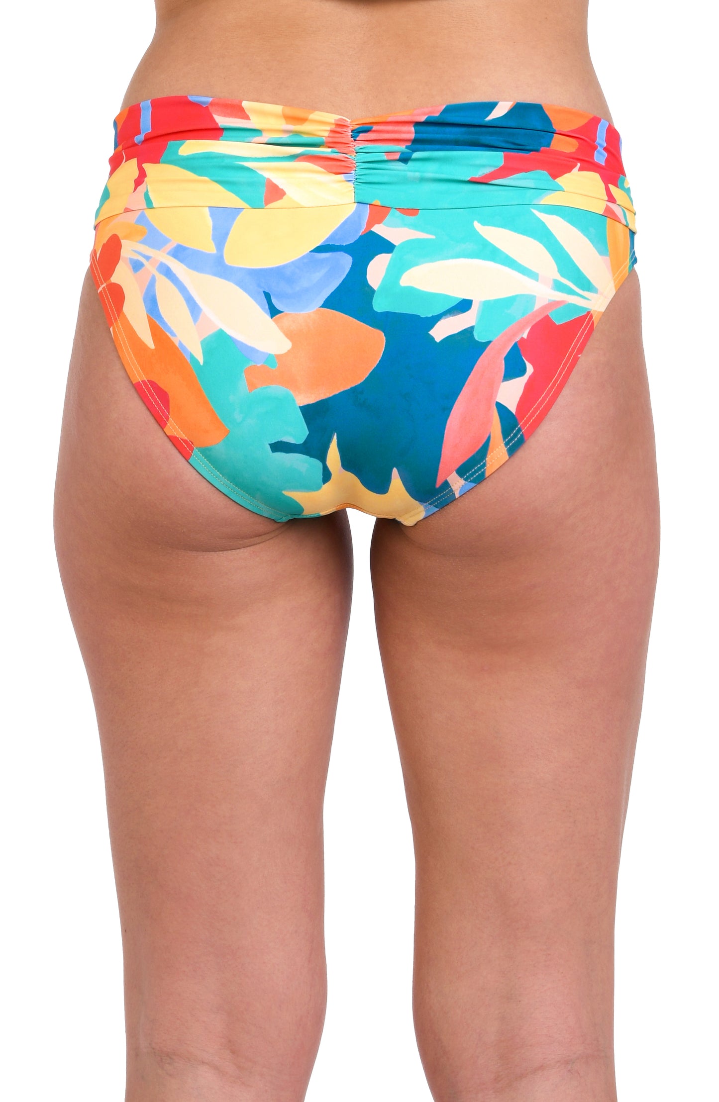 Model is wearing an orange, pink, blue, and aqua multicolored tropical patterned hipster swimsuit bottom.