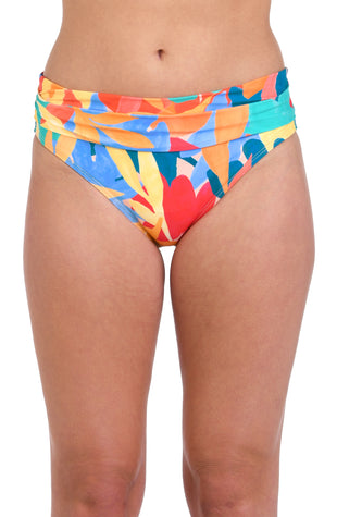 Model is wearing an orange, pink, blue, and aqua multicolored tropical patterned hipster swimsuit bottom.