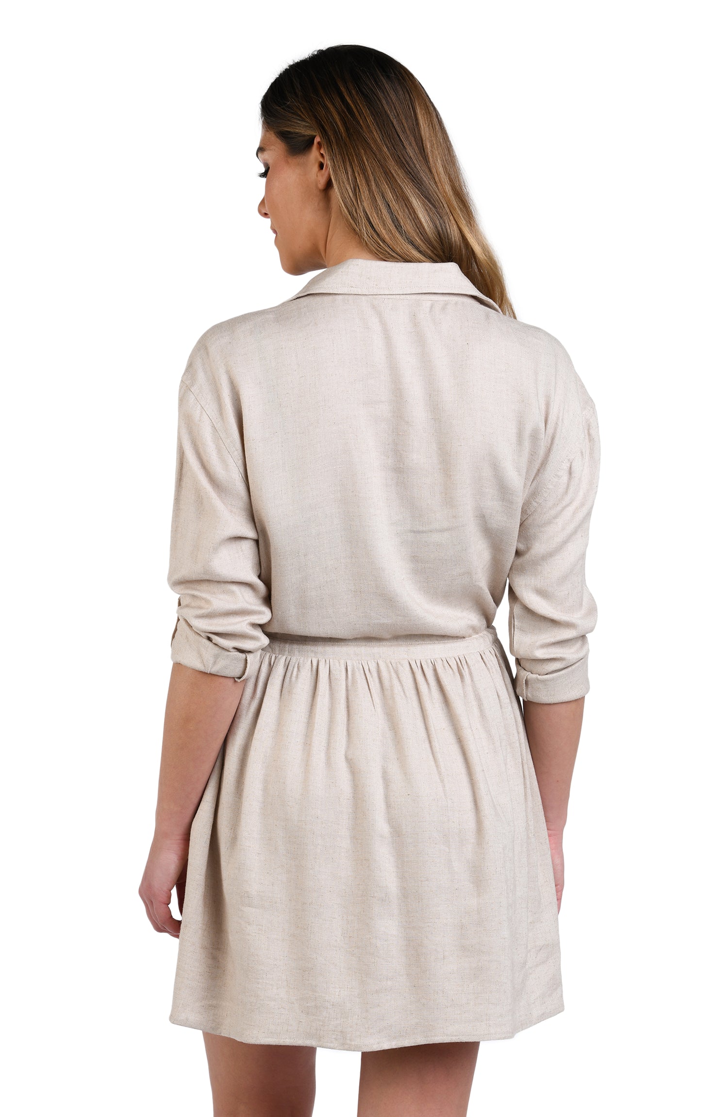 Model is wearing a solid taupe (beige) colored tunnel shirt dress cover up.