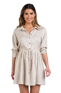 Model is wearing a solid taupe (beige) colored tunnel shirt dress cover up.