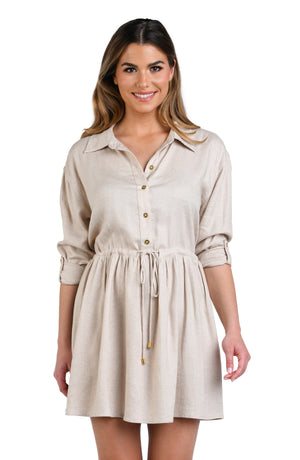 Model is wearing a solid taupe (beige) colored tunnel shirt dress cover up.