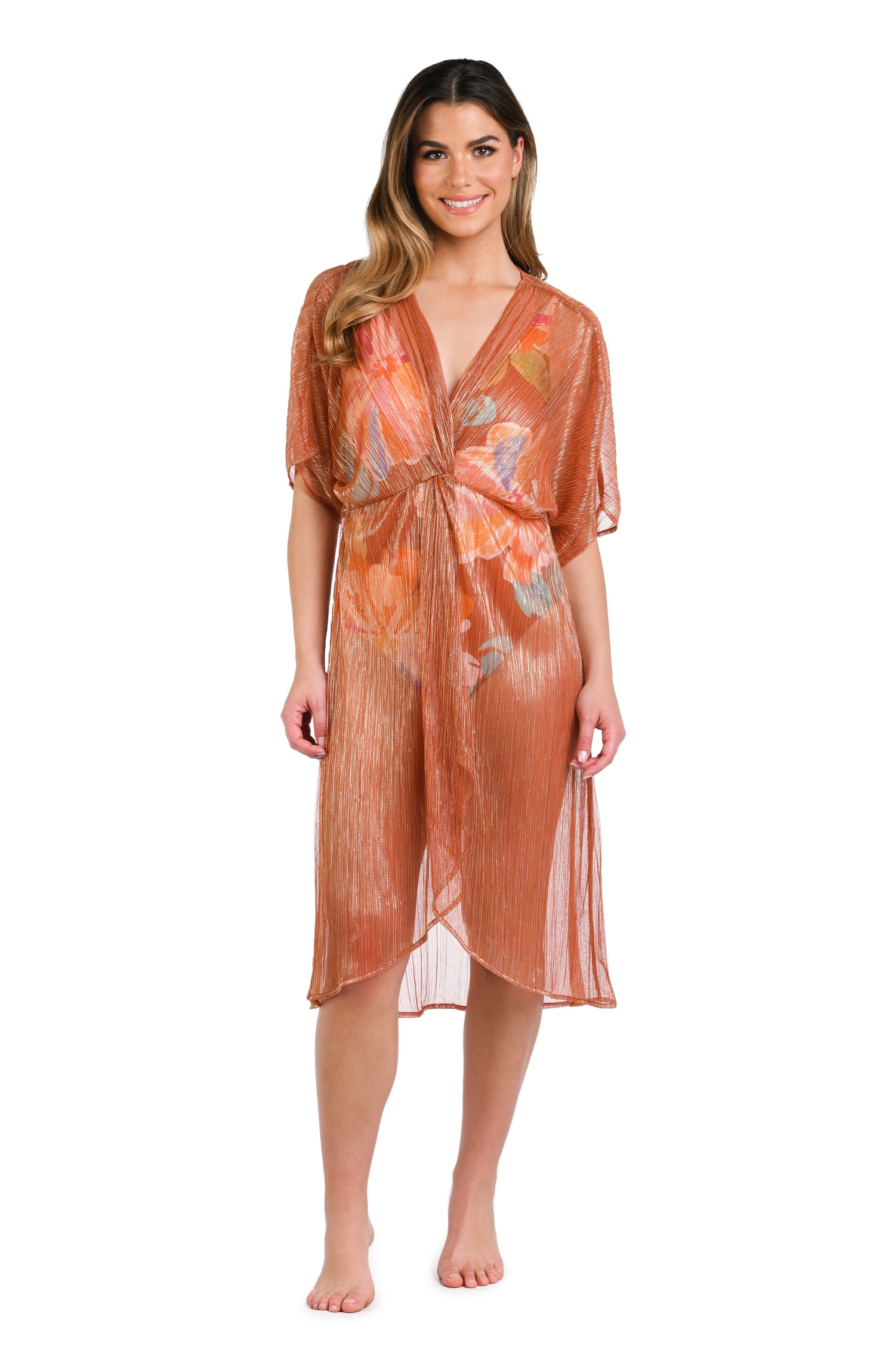 Model is wearing a shimmering orange and pink short sleeve midi dress cover up.