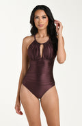 Front image of model wearing a truffle (brown) colored one-piece swimsuit with a halter neckline, keyhole cutout, and ruched detailing at the waist.