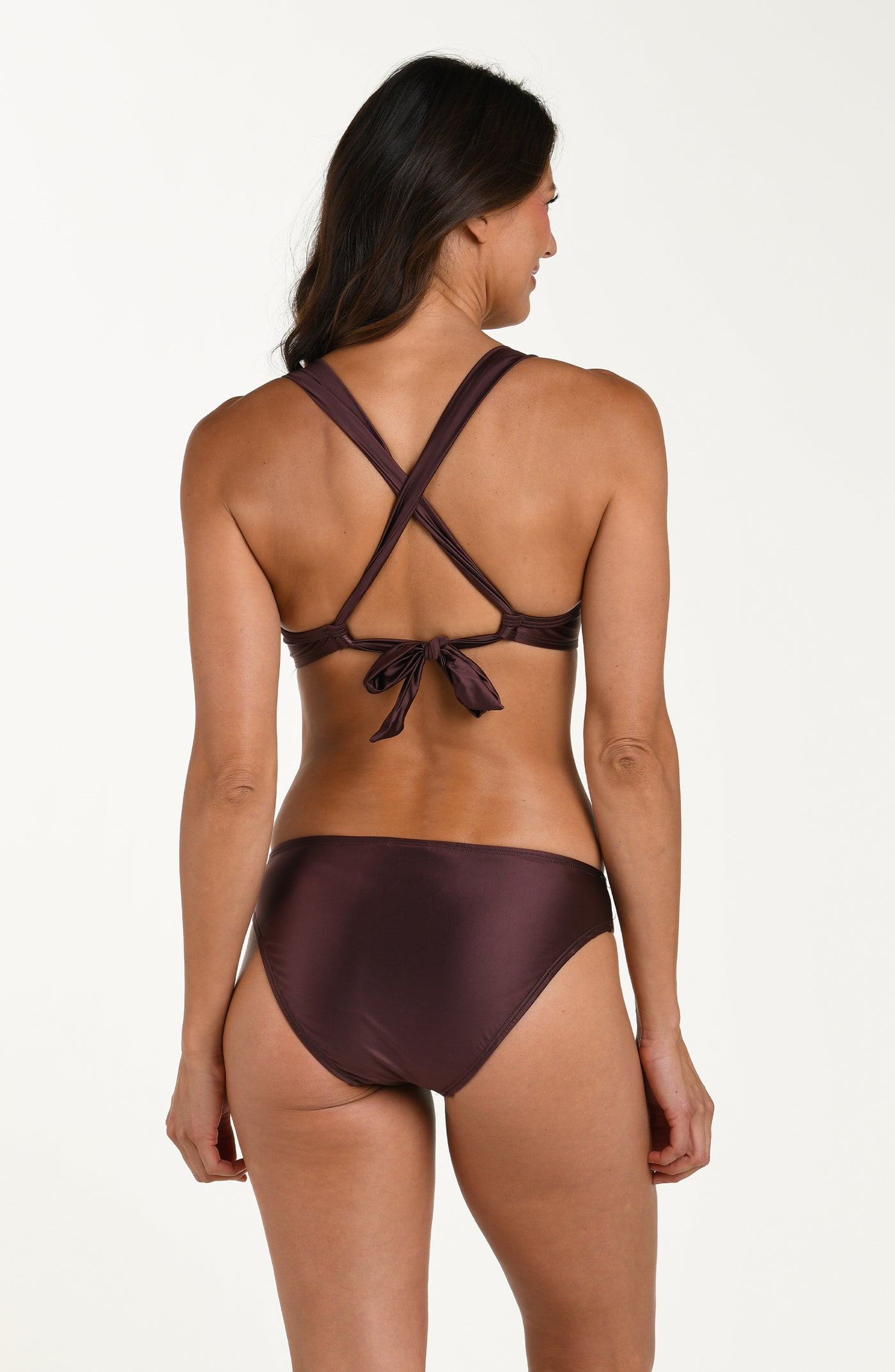 
                  
                    Full body back image of model wearing a halter bikini top in a truffle (brown) color with ruched triangle featuring wide straps that crisscross and tie at the lower back. This is paired with matching bikini bottoms. 
                  
                