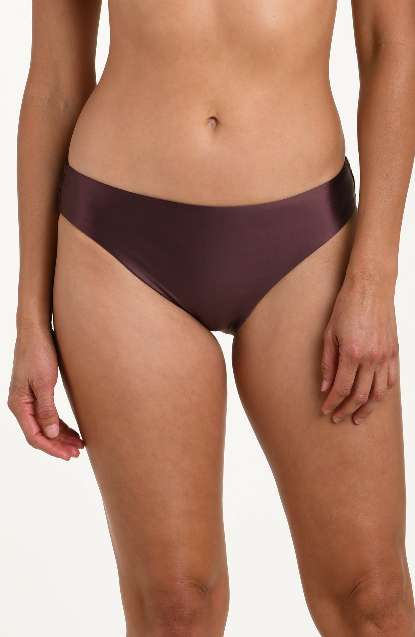 
                  
                    Front image of model wearing basic hipster bikini bottoms in a truffle (brown) color. 
                  
                