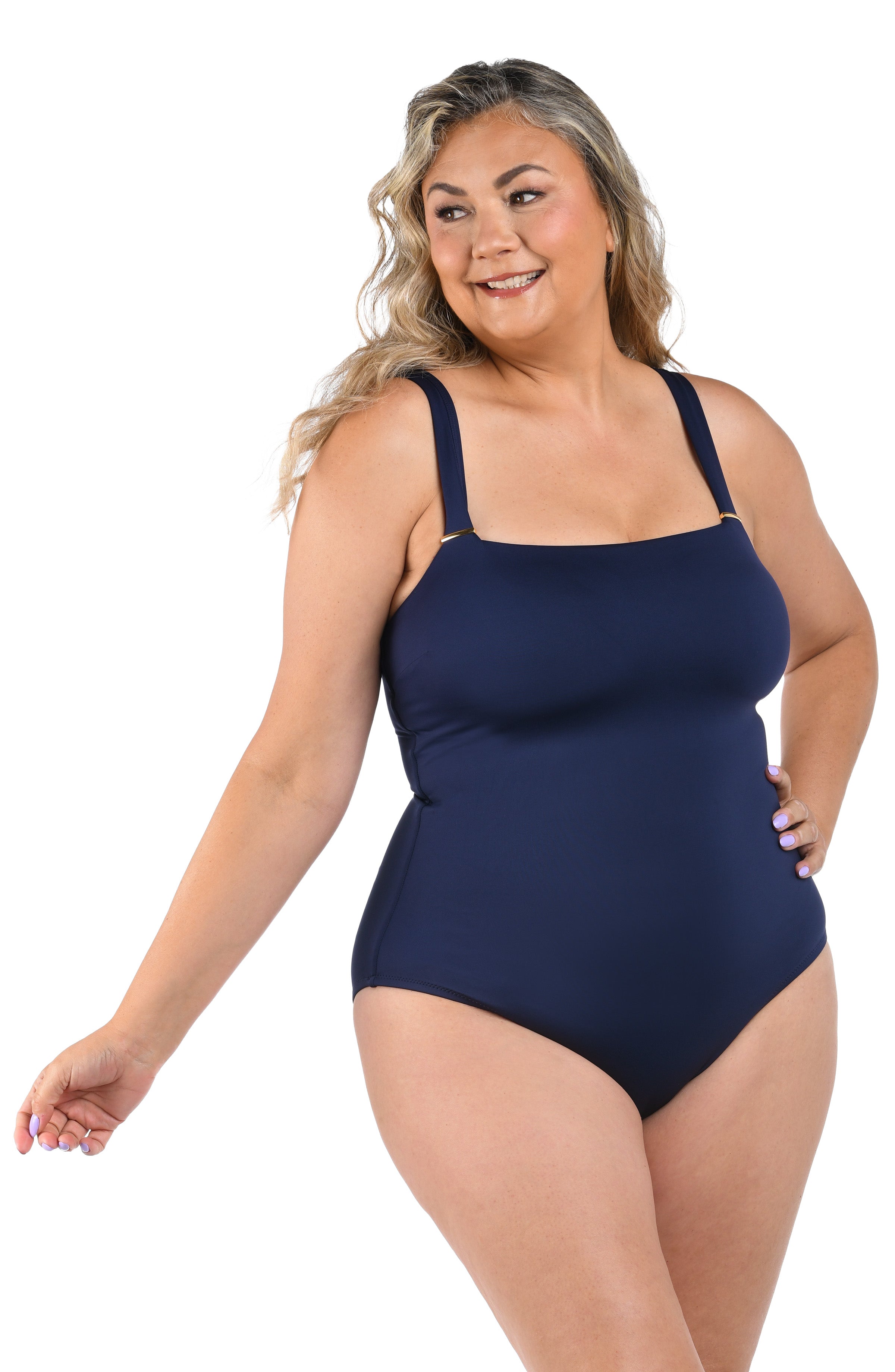 Model is wearing a LB LUXE Over the Shoulder One Piece in Indigo.