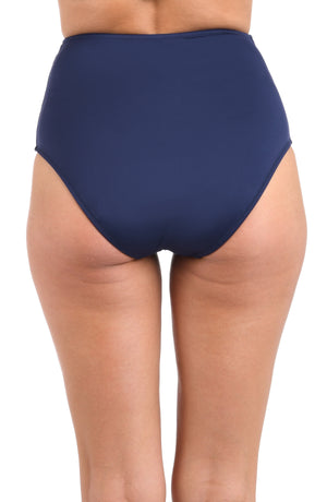 Model is wearing a LB LUXE Ultra High Waist Bottom in Indigo.