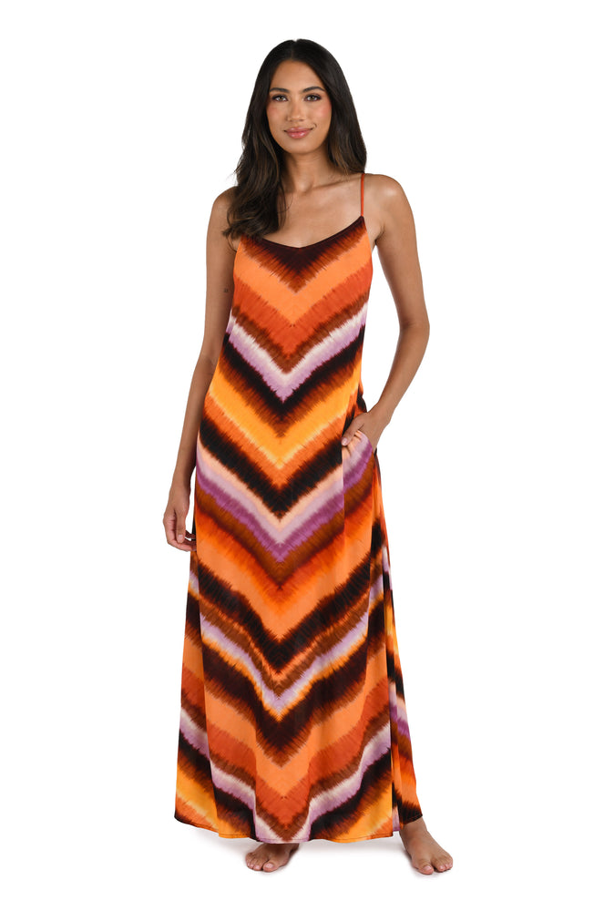 Model is wearing an Upon the Horizon Over the Shoulder Maxi Dress.