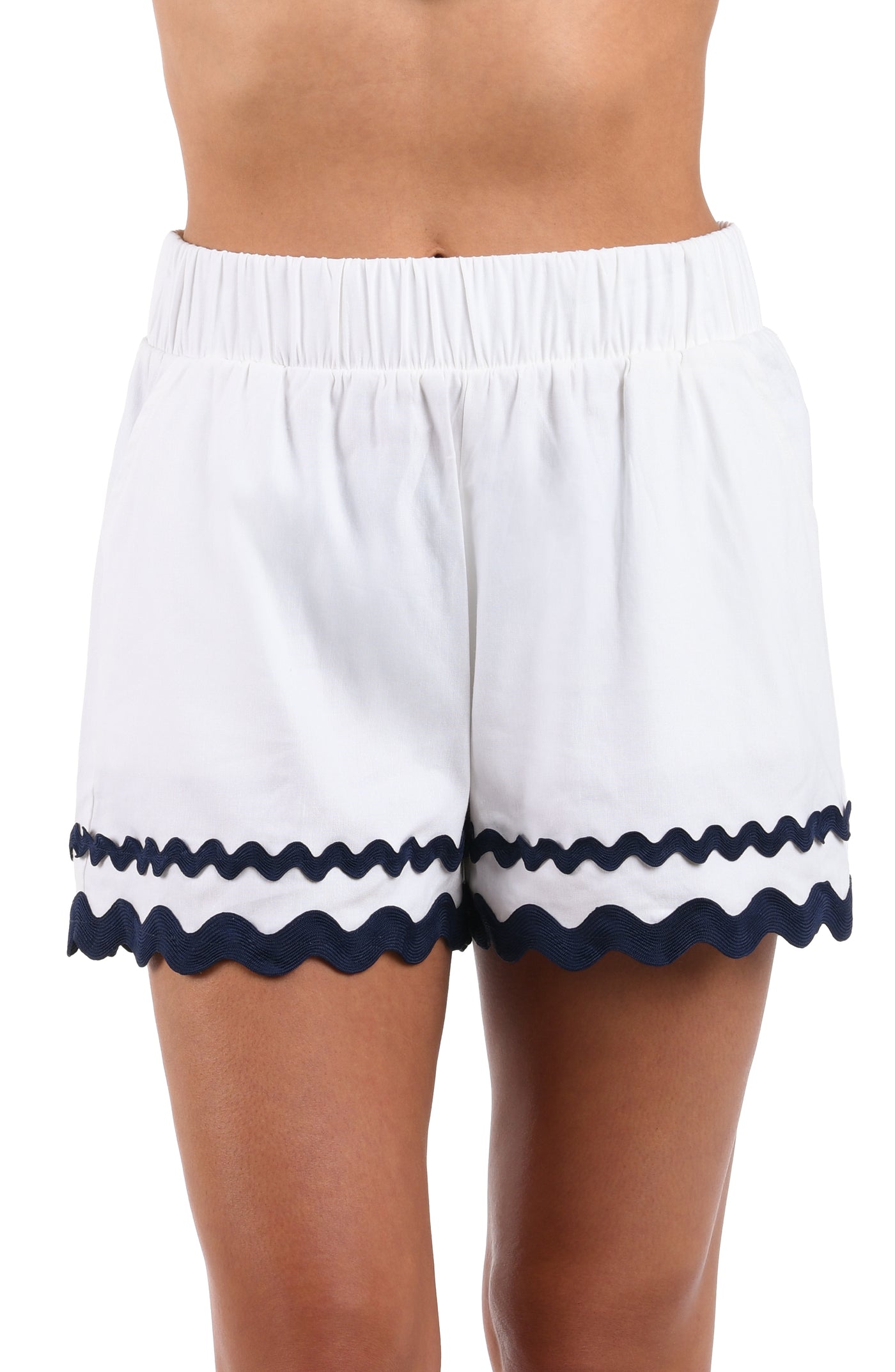 
                  
                    Front image of model wearing the Poolside Chic Beach Shorts in white and indigo.
                  
                