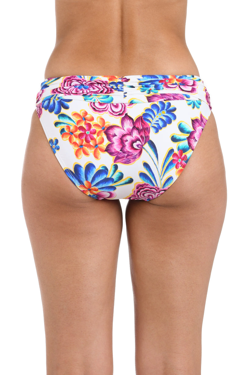 Back image of model wearing the Flor De Paradiso Shirred Band Hipster Bottom.