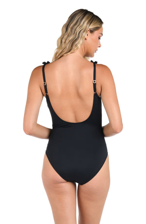 Model is wearing the Island Goddess Ruffle V-Plunge One Piece in Black.