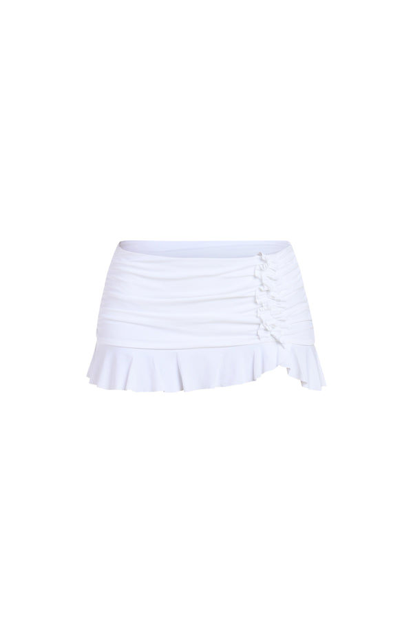 Floating image of a white swim skirt with ruched side detail and ruffled hem.