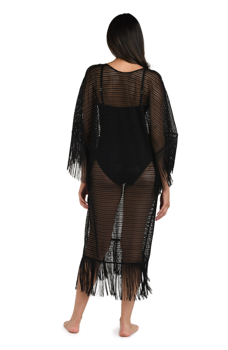 Model is wearing a Fringed Out Long Caftan Cover Up in Black.