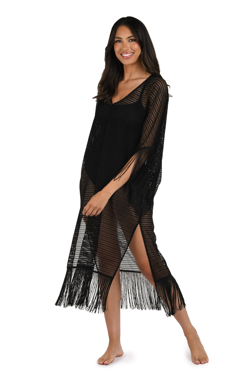 Model is wearing a Fringed Out Long Caftan Cover Up in Black.