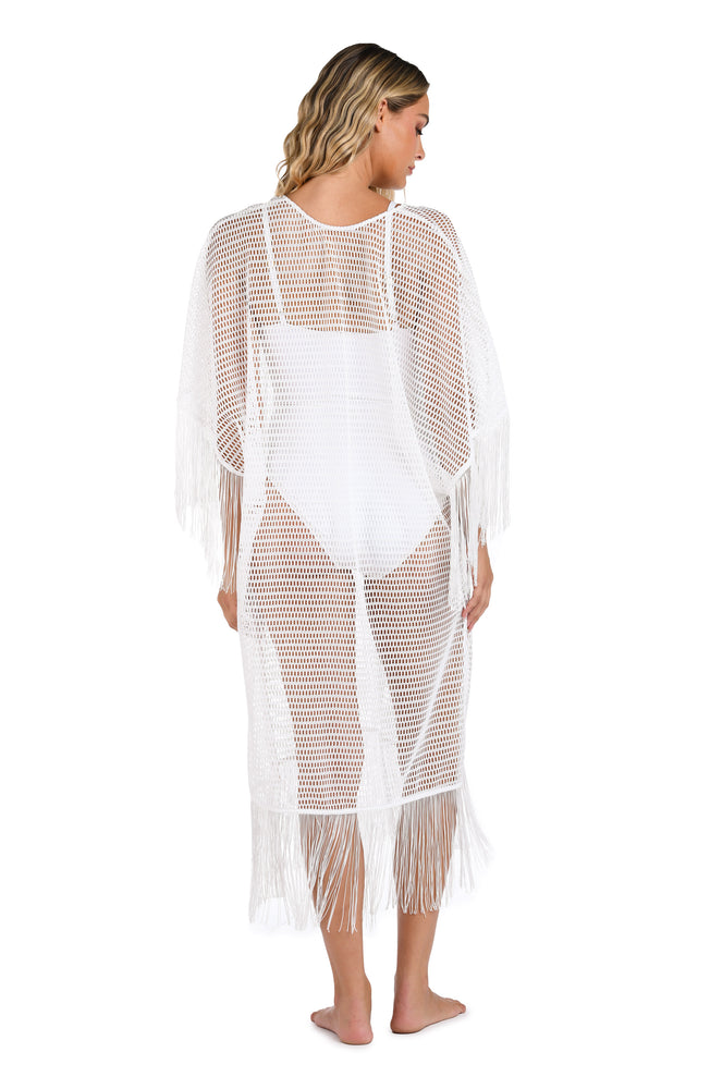 Model is wearing a Fringed Out Long Caftan Cover Up in White.