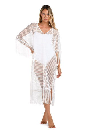 Model is wearing a Fringed Out Long Caftan Cover Up in White.