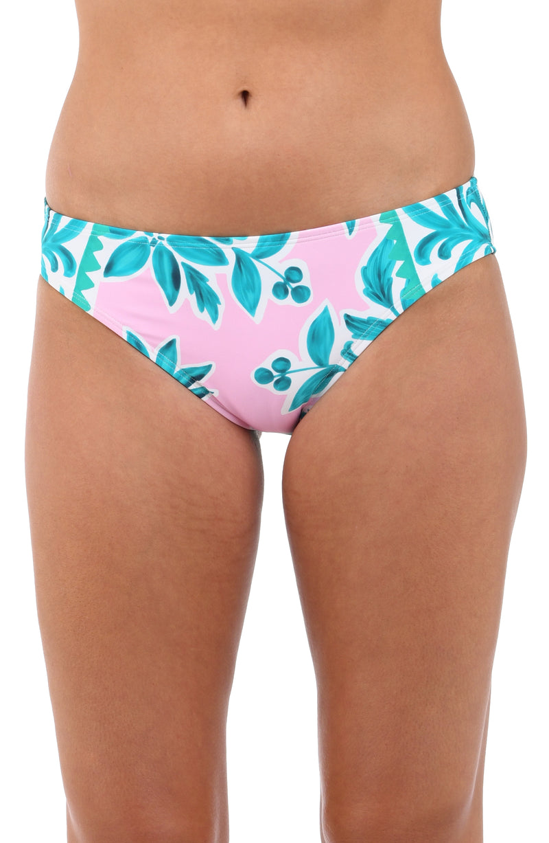 Front image of model wearing the Opulent Palm Hipster Bottom in multi color green and pink.