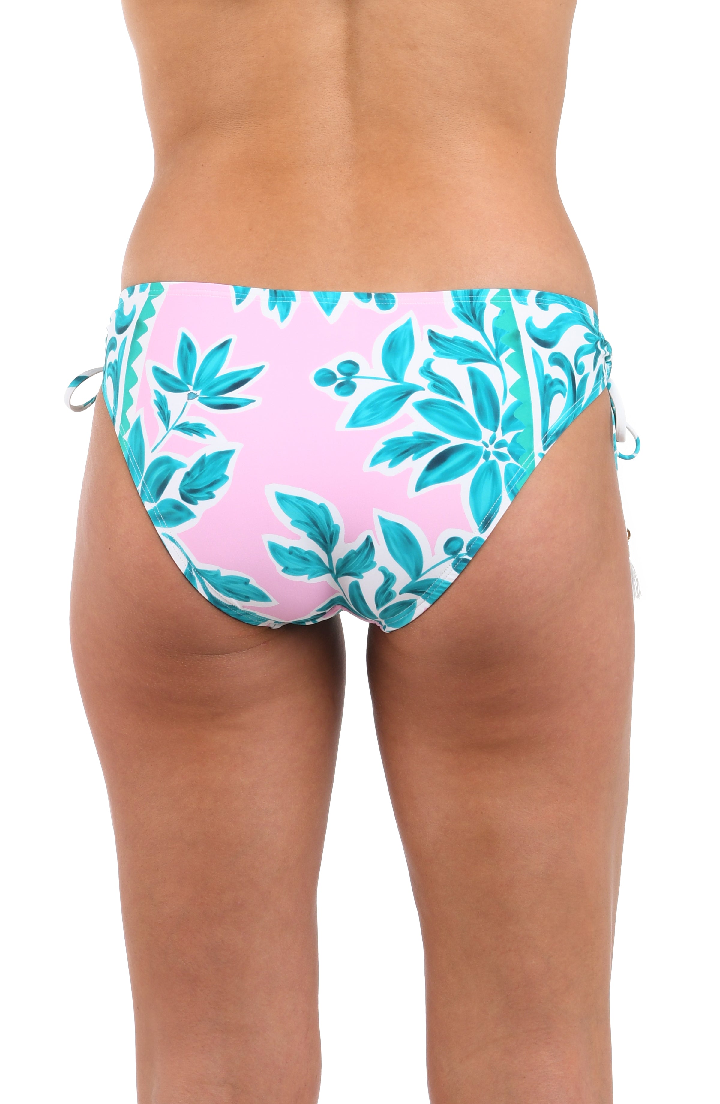 Back image of model wearing the Opulent Palm Side Tie Hipster Bottom in multi color green and pink.
