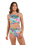 Front image of model wearing the Tropi-flage High-Neck Midline Top w/Mesh Details in a bright multi colored tropical print.