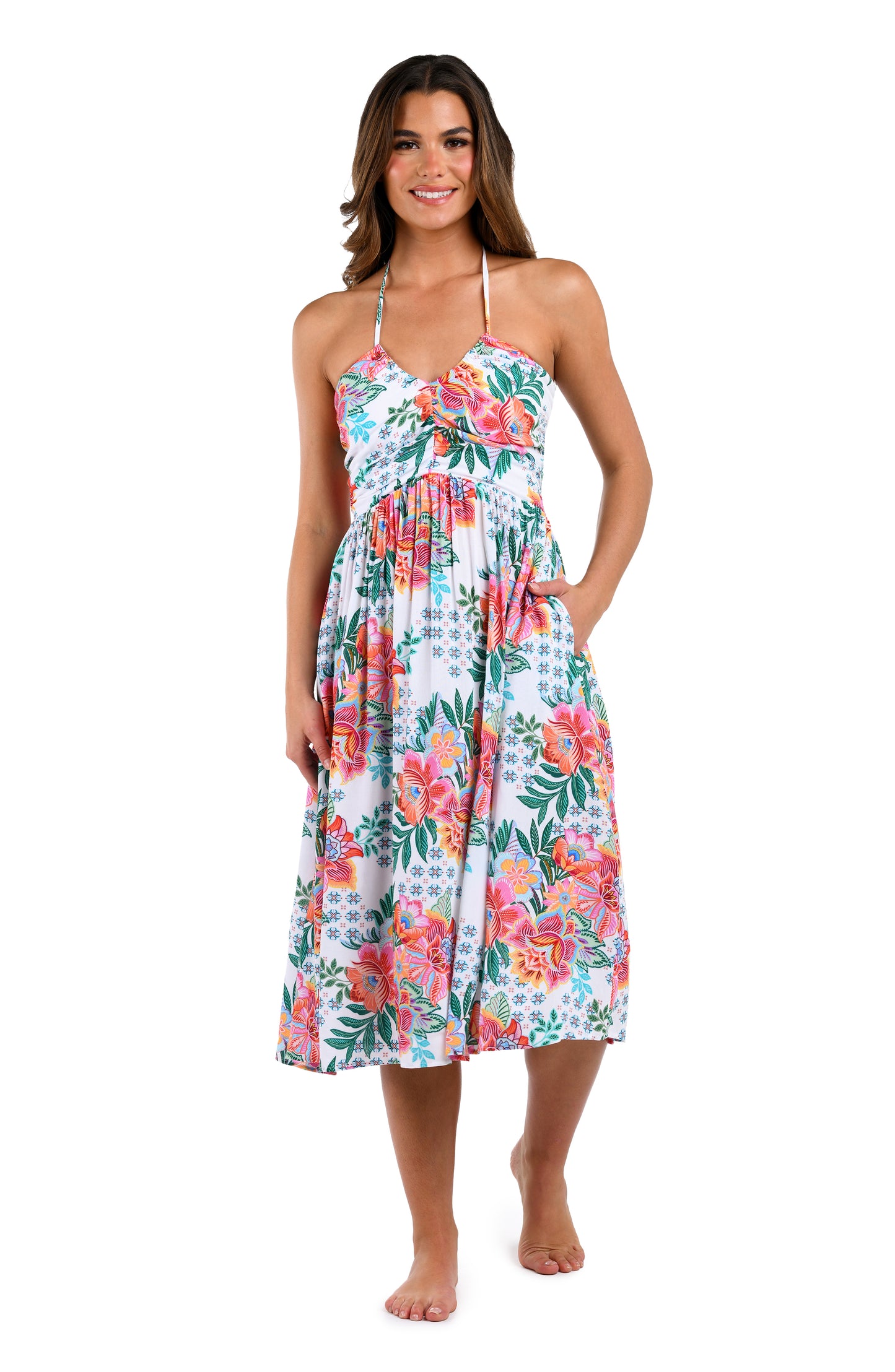 Front image of model wearing the Riviera Resort Halter Midi Dress Cover Up in a white multi colored tropical print.