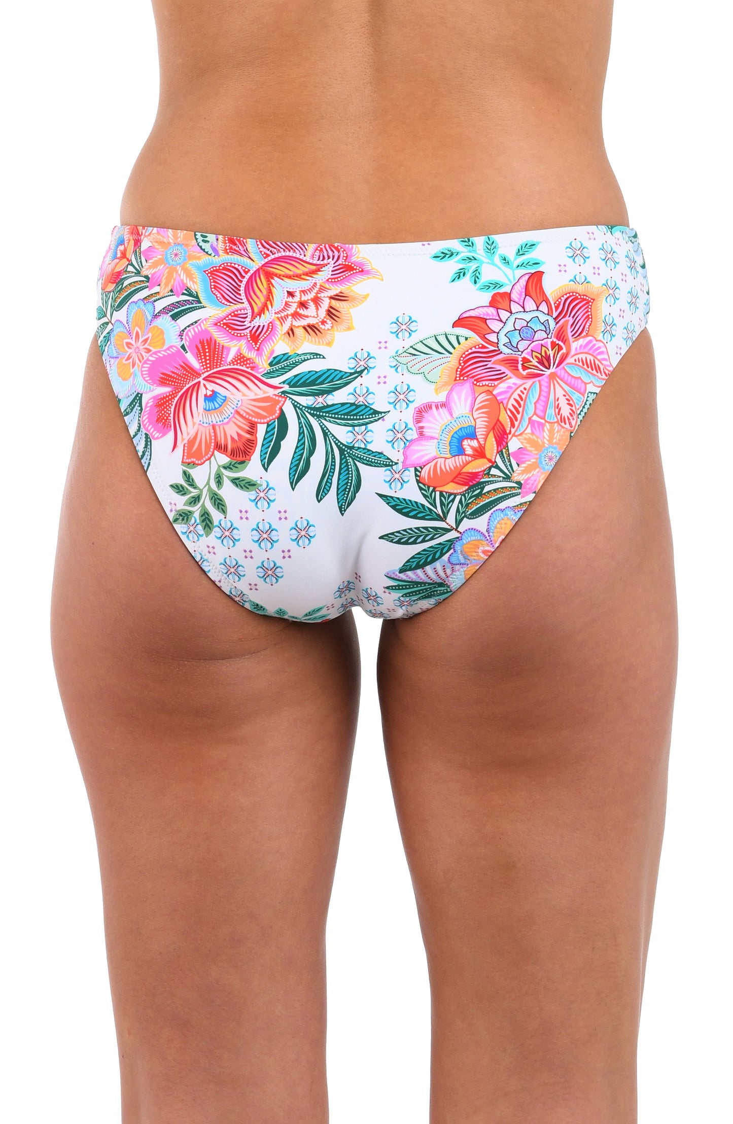 Back image of model wearing the Riviera Resort Reversible Hipster Bottom in a white multi colored tropical print.