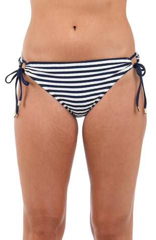 Front image of model wearing the Set Sail Side Tie Hipster Bottom in white and indigo.