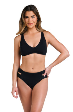 Model is wearing a solid black colored over-the-shoulder bikini swimsuit top.