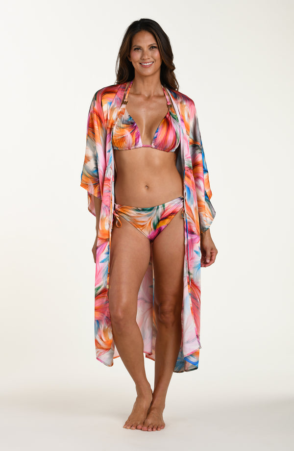 Full body front image of model wearing a multicolored feather printed long kimono-style cover-up featuring  wide sleeves and a drawstring waist. 