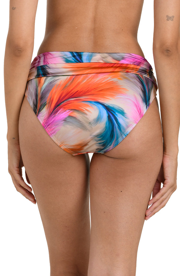 Back image of model wearing a multicolored feather printed bikini bottom with a mid-rise fit, banded, and moderate rear coverage.