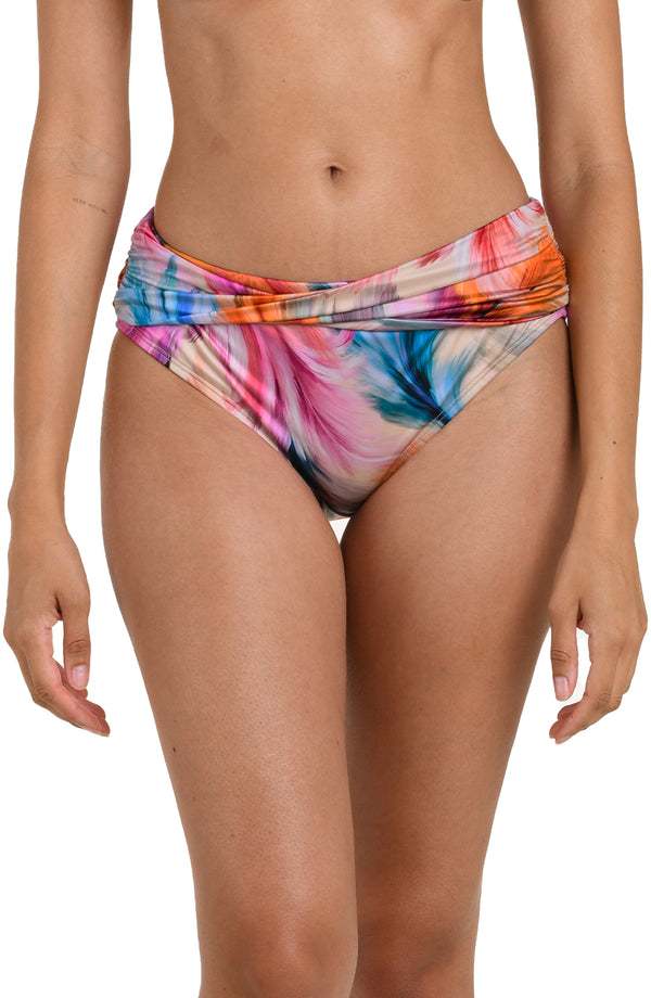 Front image of model wearing a multicolored feather printed bikini bottom with a mid-rise fit and a flattering crossover waistband design.