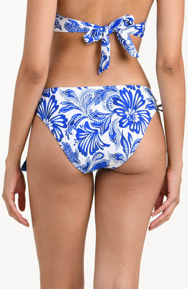 Blue and white patterned bikini bottom on a white background
