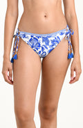 Blue and white patterned bikini bottom on a white background