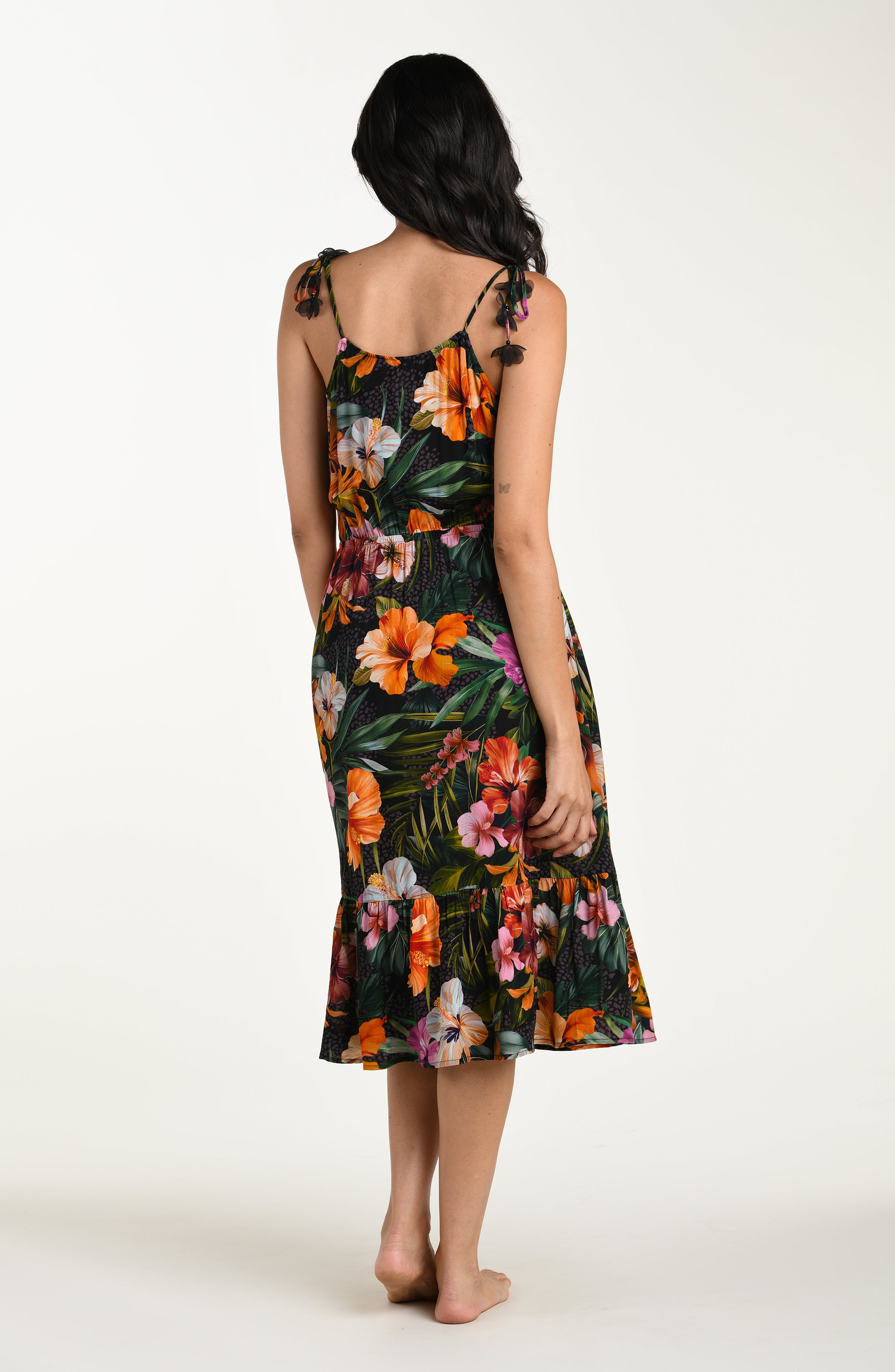 Full body back image of a model wearing a multicolored tropical printed cover-up dress featuring a relaxed, flowy fit with lightweight fabric and adjustable straps for all-day comfort.