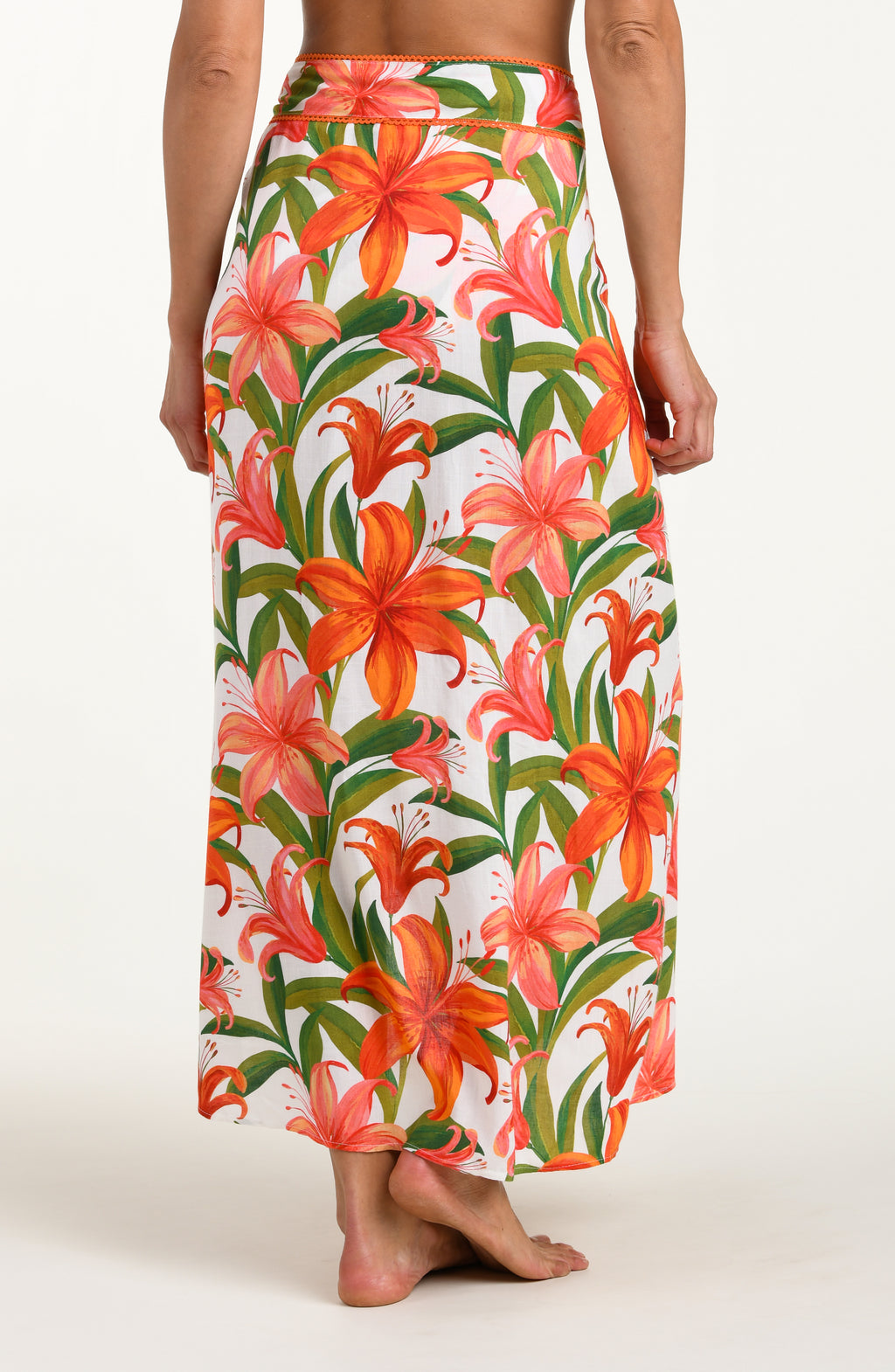 Woman wearing a floral skirt on a white background