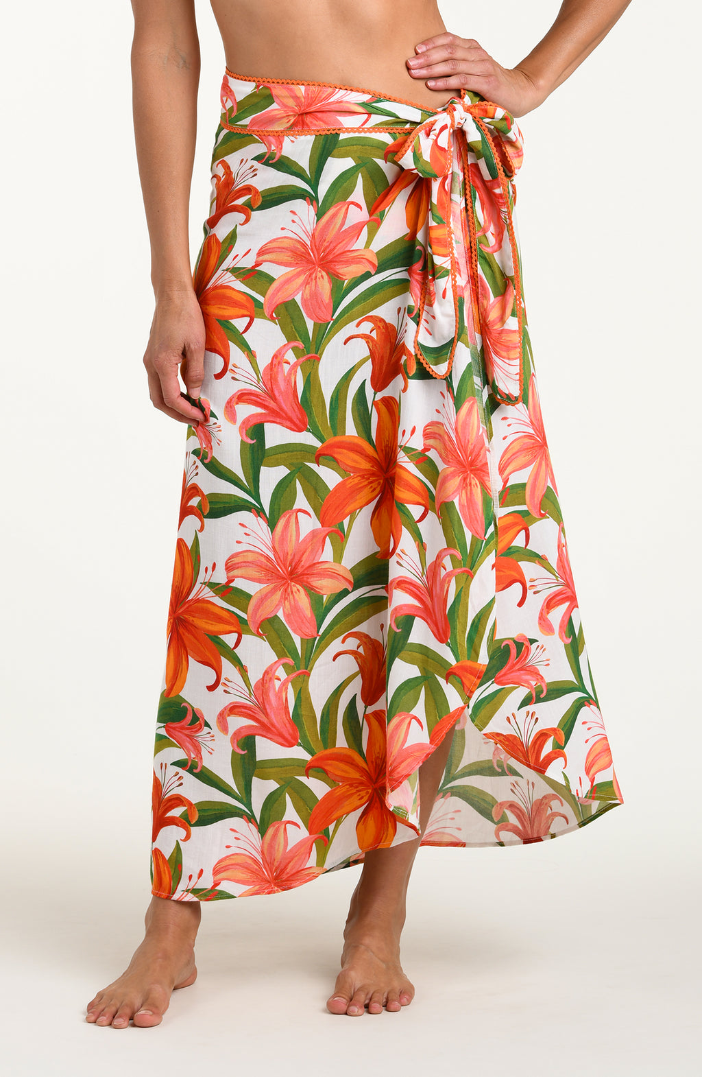 Woman wearing a floral skirt on a white background