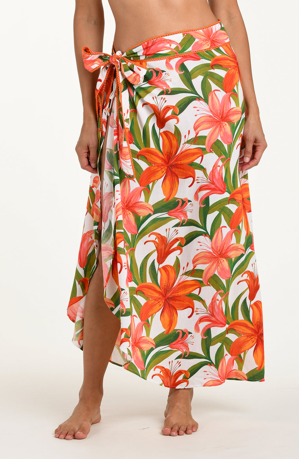 Woman wearing a floral skirt on a white background