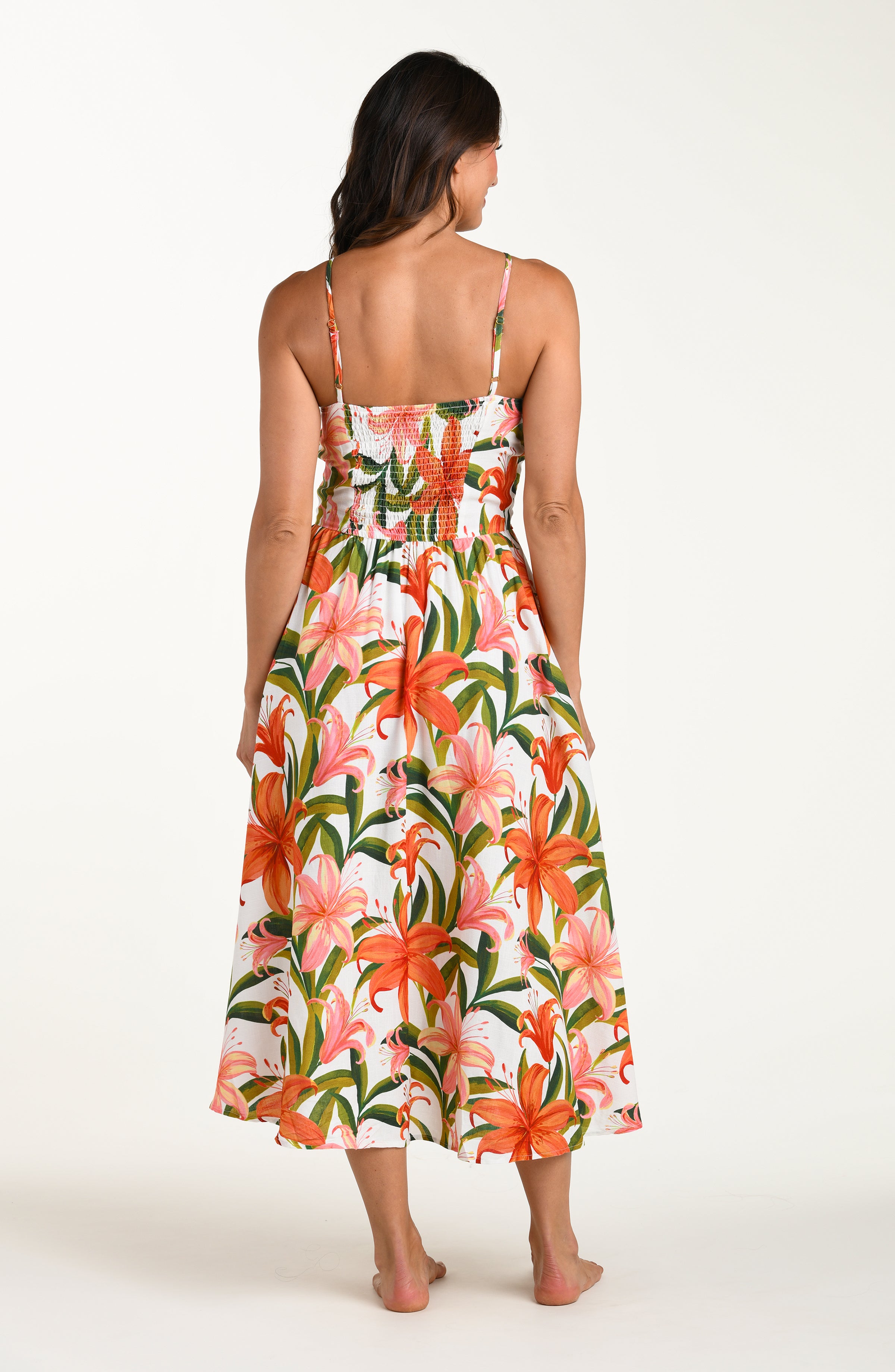 Woman wearing a floral cover-up dress on a white background