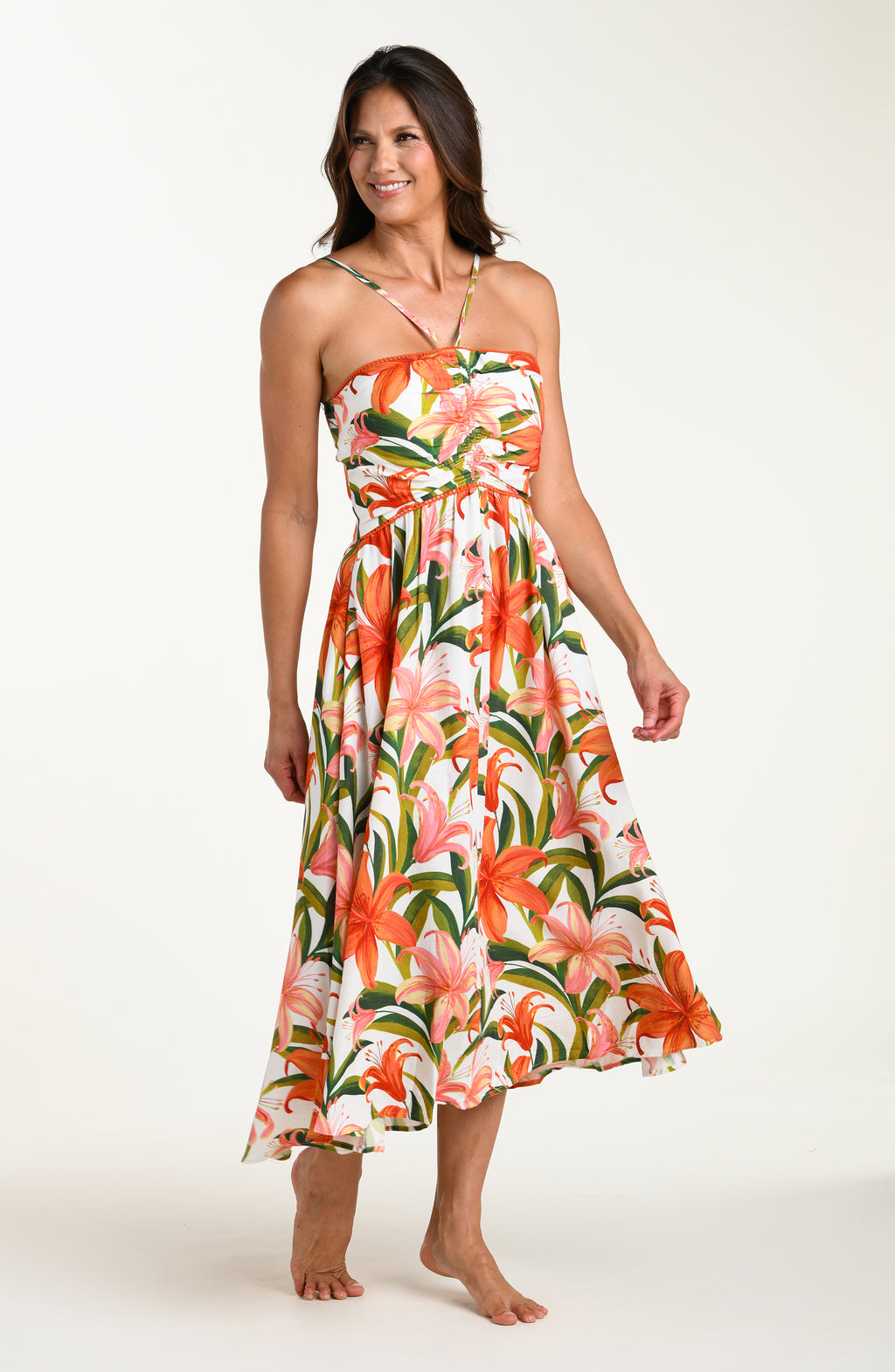 Woman wearing a floral cover-up dress on a white background