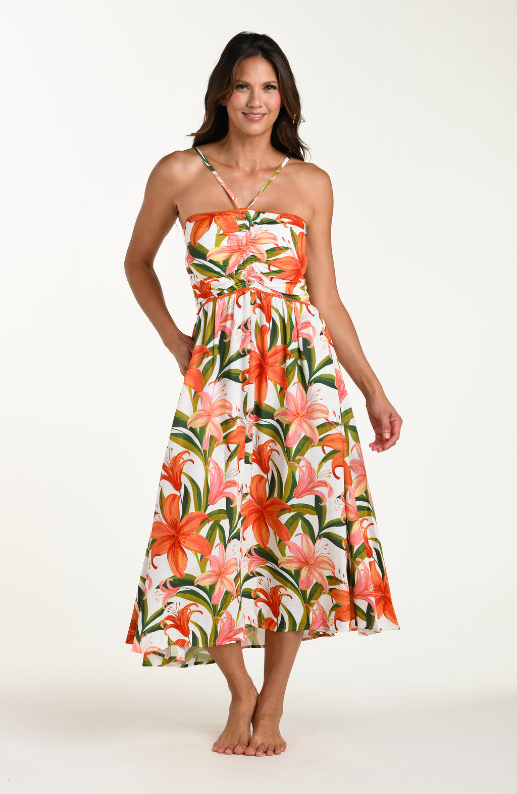 Woman wearing a floral cover-up dress on a white background