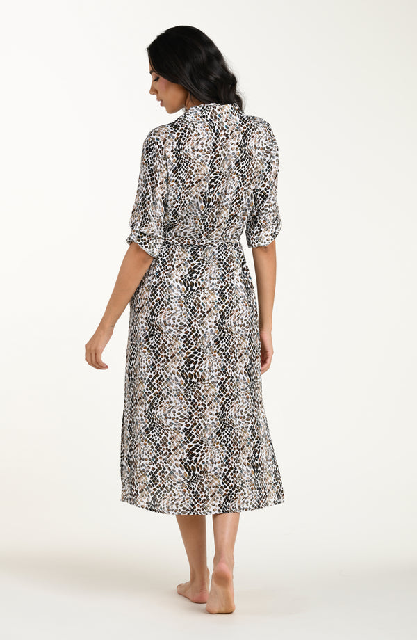 Full body back image of model wearing a midi-length cover-up dress featuring a taupe colored animal print with three-quarter sleeves, a V-neckline, and a waist tie belt.
