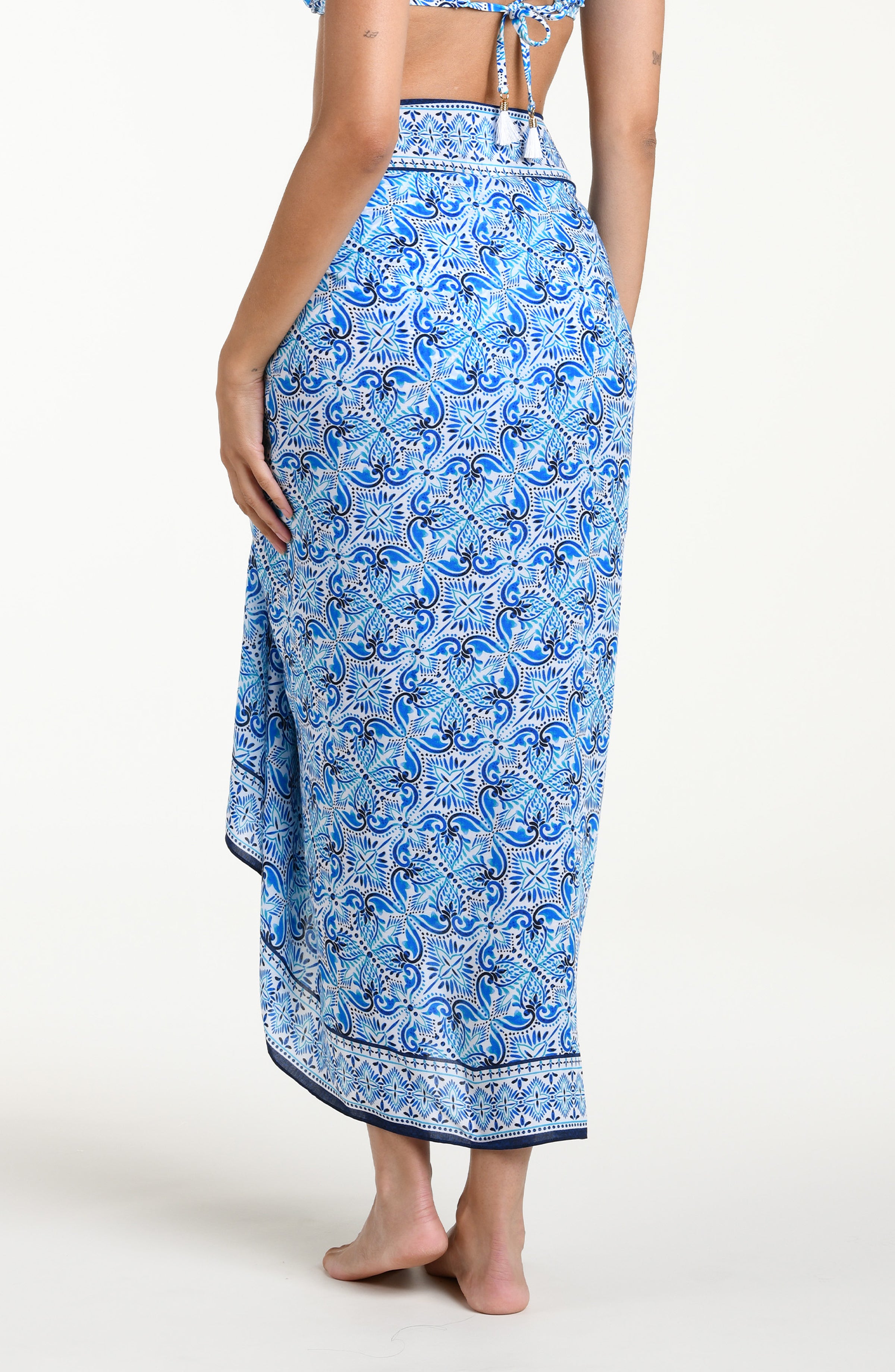 Blue floral patterned sarong against a white background