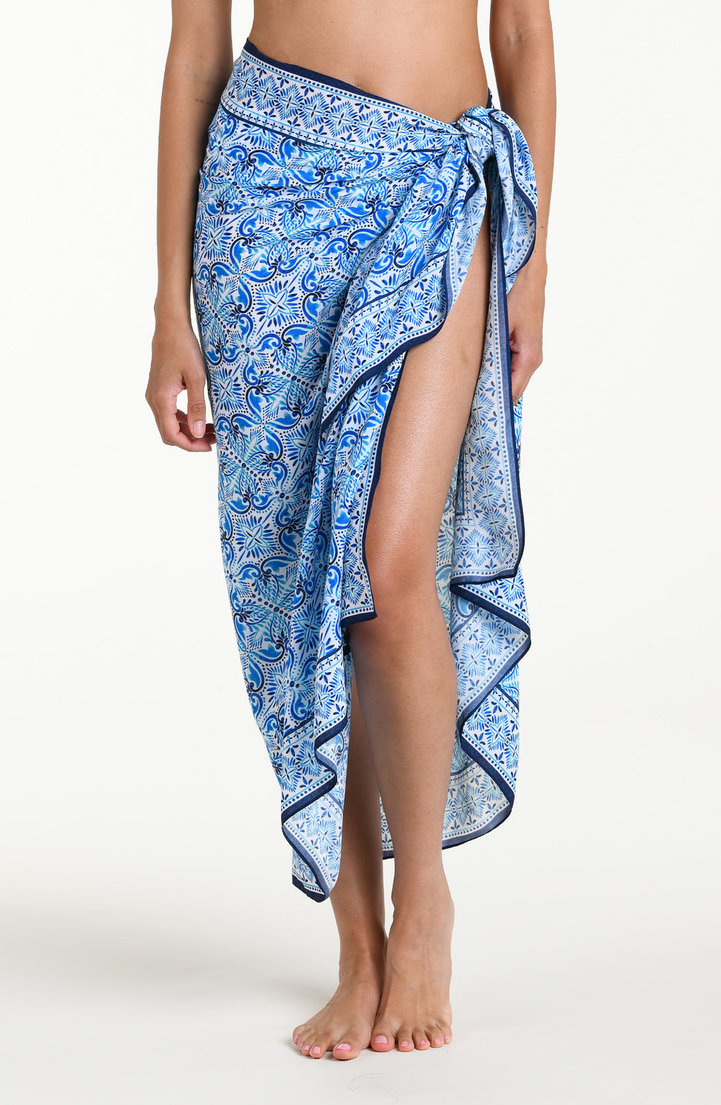 Blue floral patterned sarong against a white background
