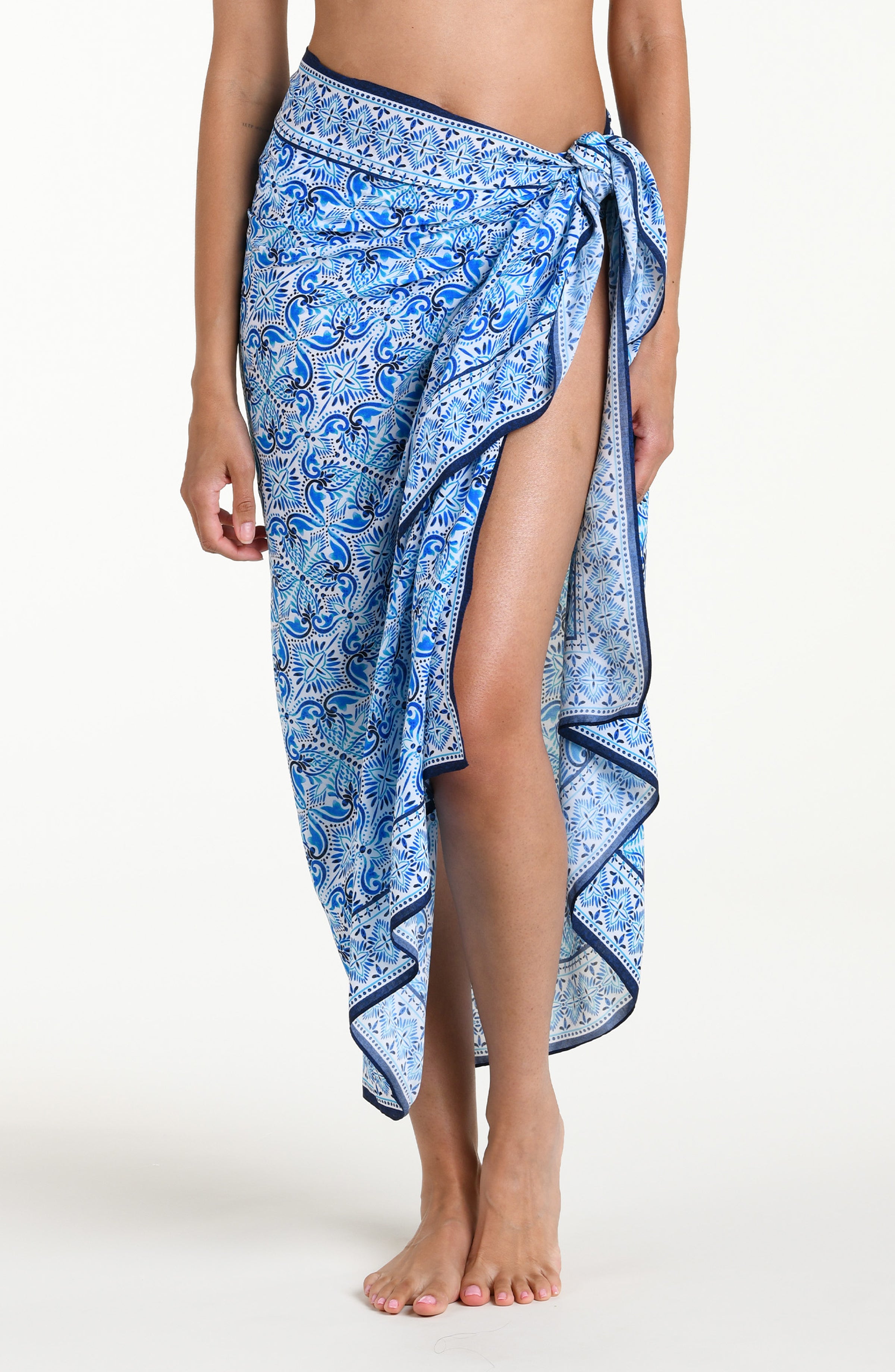 Blue floral patterned sarong against a white background