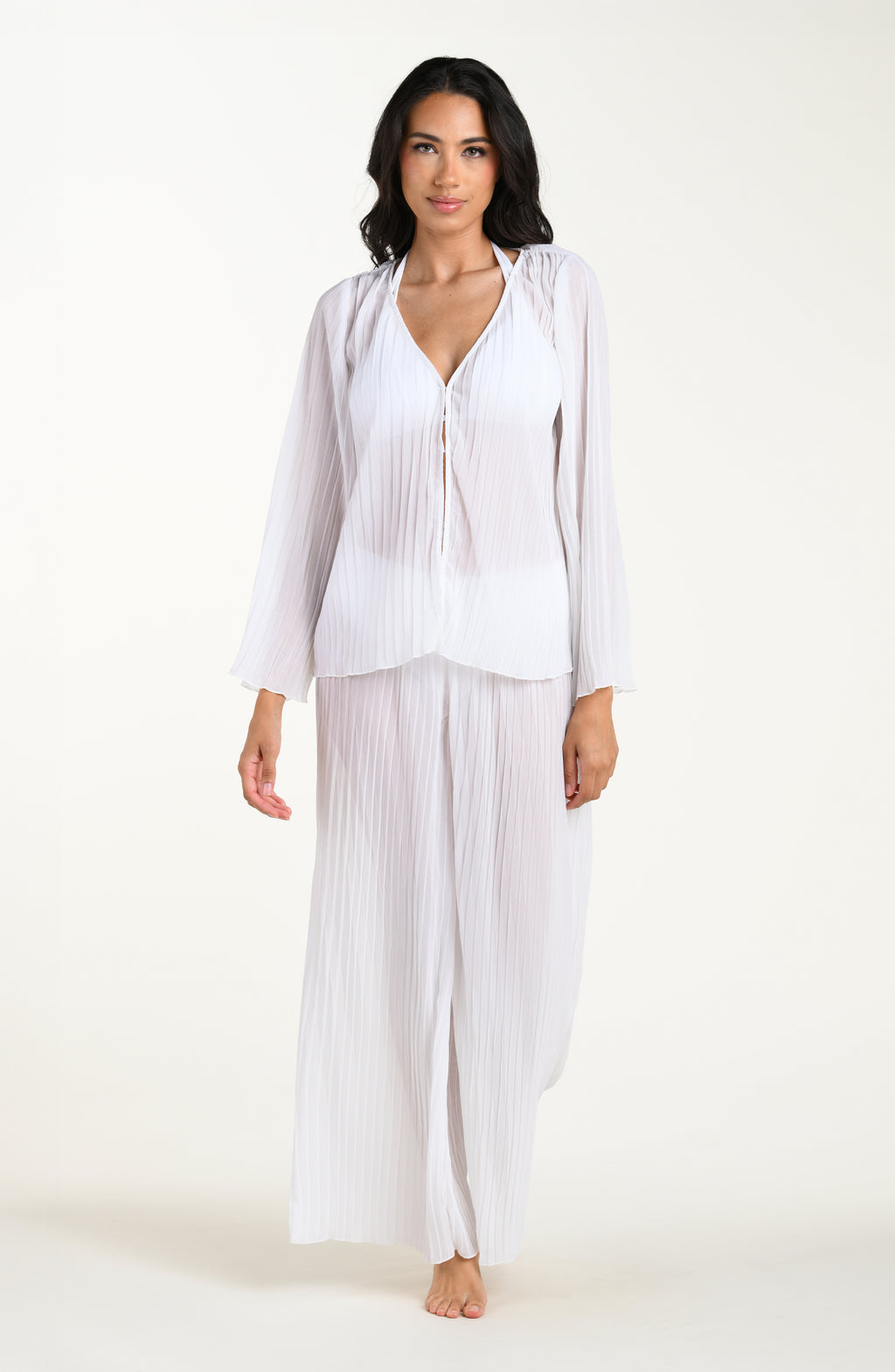 Woman wearing a white outfit on a white background