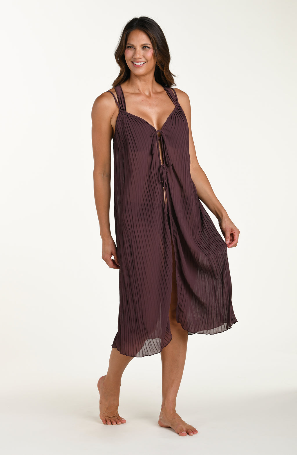 Woman wearing a brown dress on a white background