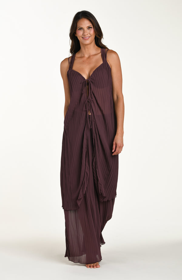 Woman wearing a burgundy evening gown on a white background